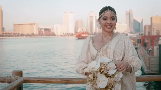 Bride at golden hour by Dubai Creek